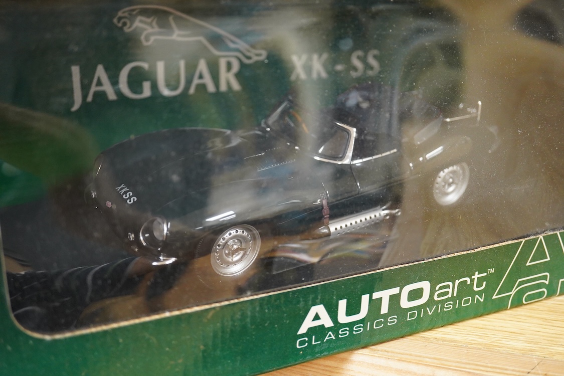 Two boxed Auto Art 1:18 scale Jaguar racing cars; a D type Jaguar and a Jaguar XK-SS